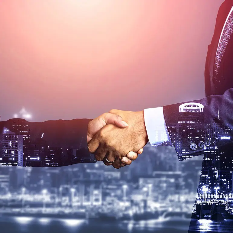 An image depicting a handshake between two individuals, symbolizing partnership, collaboration, and professionalism in employer of record, payroll, recruitment, workforce management, and manpower services. The handshake signifies mutual trust, agreement, and commitment in business relationships